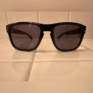 Brand New Oakley Holbrooks, all black with red on the side.